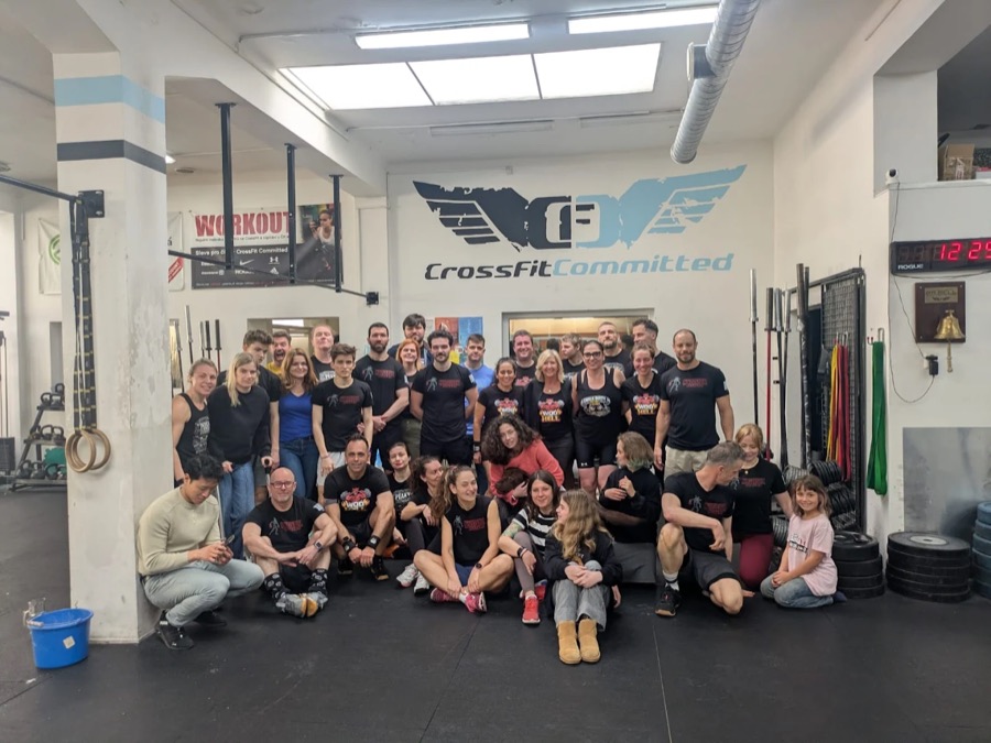 Members and their kids at a community event in the gym