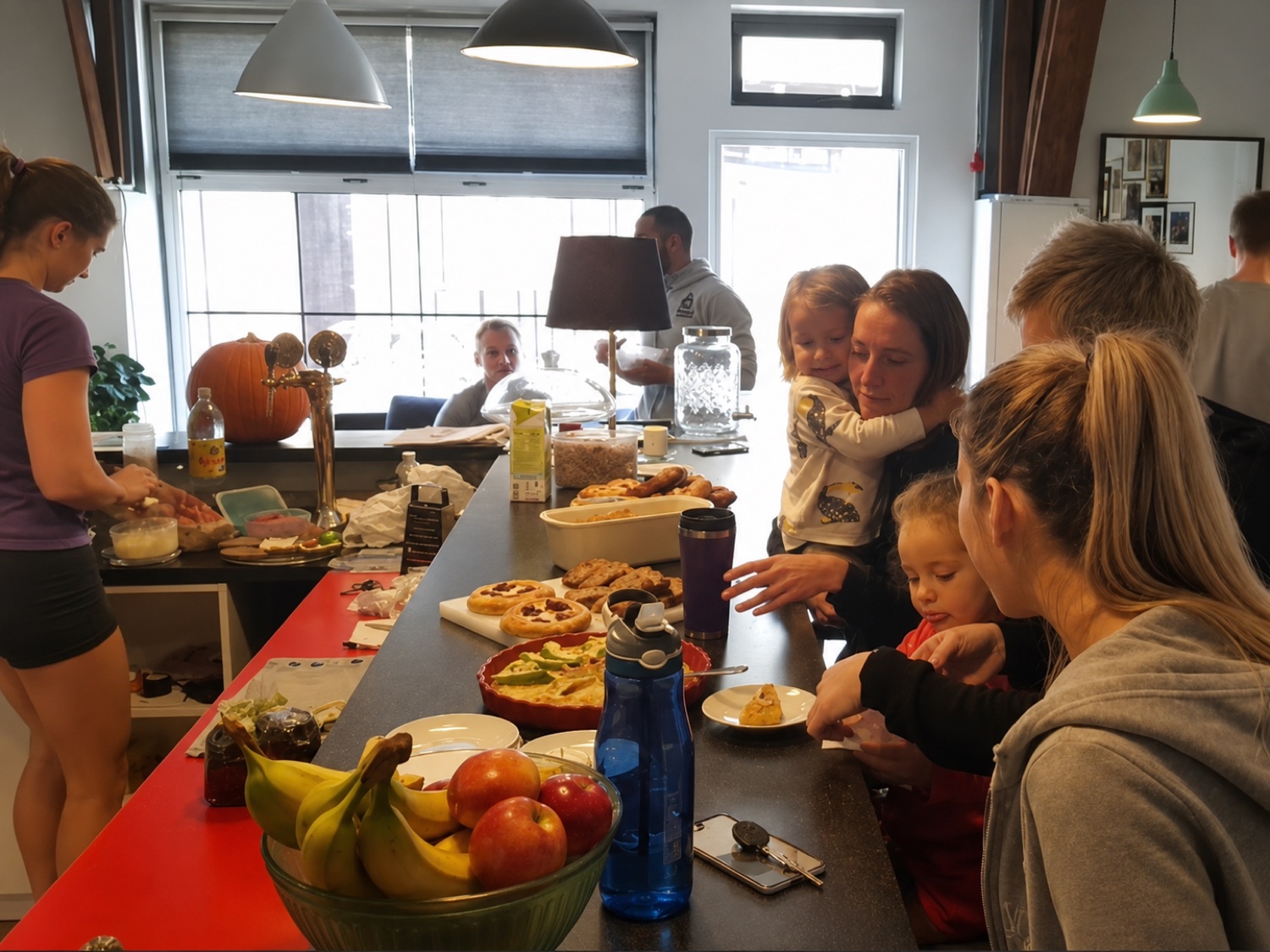 A spread of real food at the gym: fruit, fresh baking and members eating together
