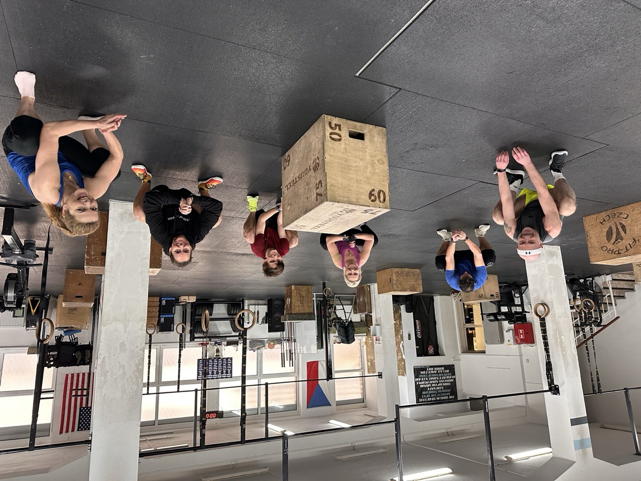 A smiling class resting between sets on the training floor